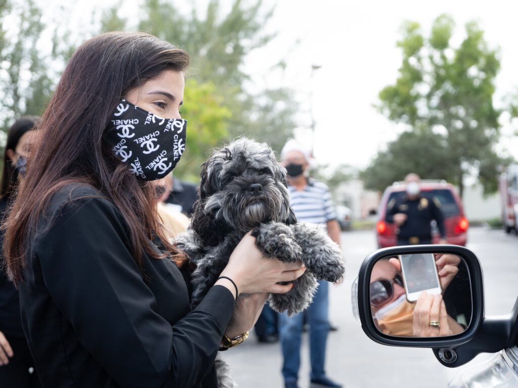 Petland Pembroke Pines picture of staff donating toys with Miami Power Team for Christmas drive-thru.